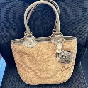 Straw Coach purse with flower. Used, great condition. Smoke and pet free home.